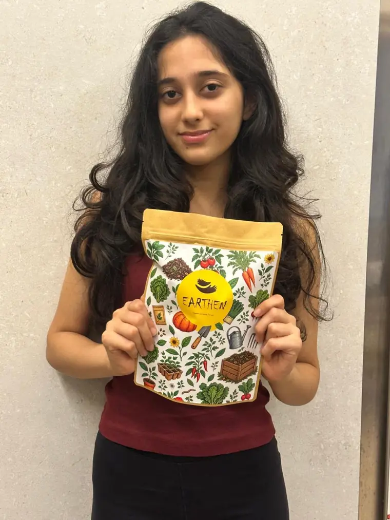 Nikita holding the Earthen compost pouch